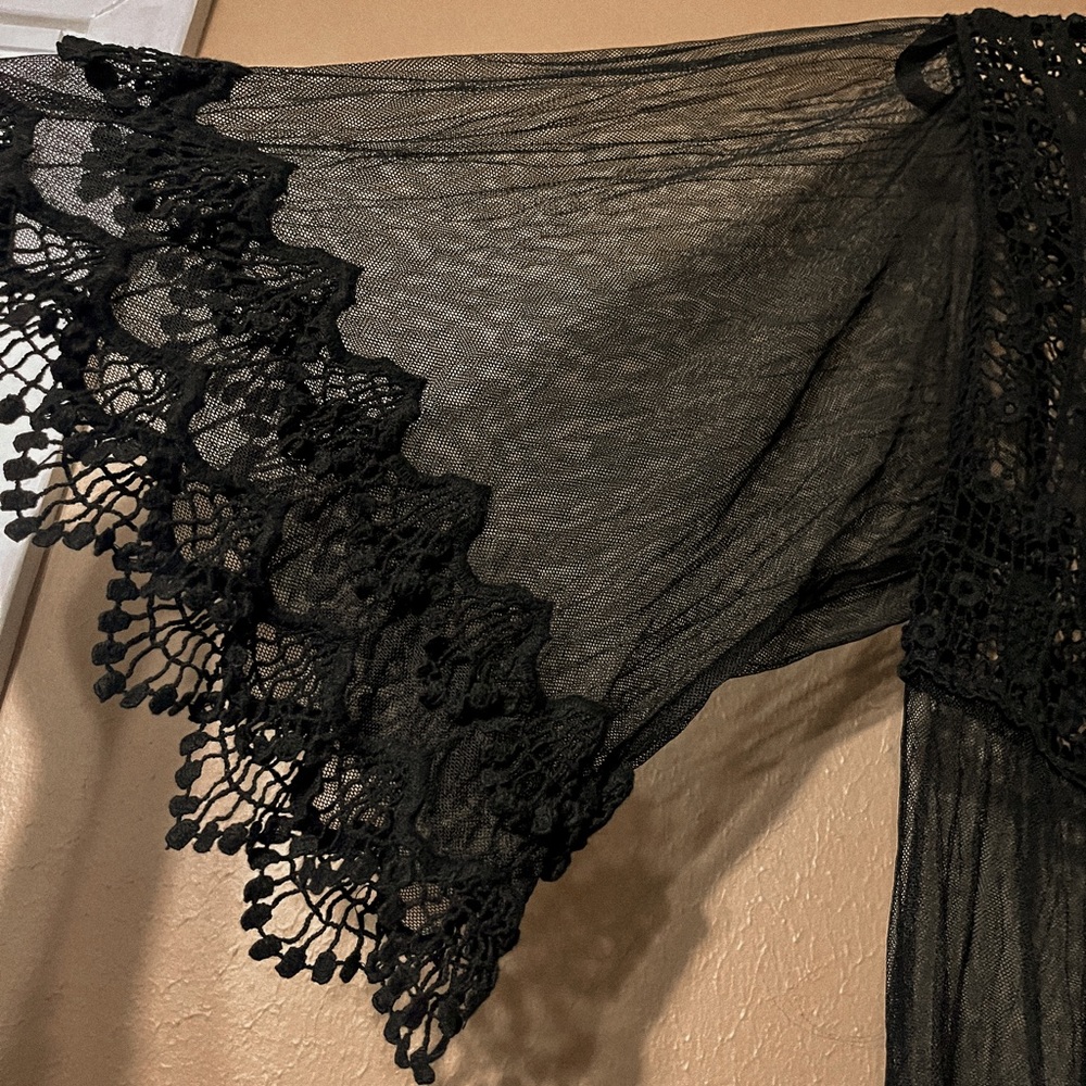 see through black lace pull over. size medium in brand pink melo